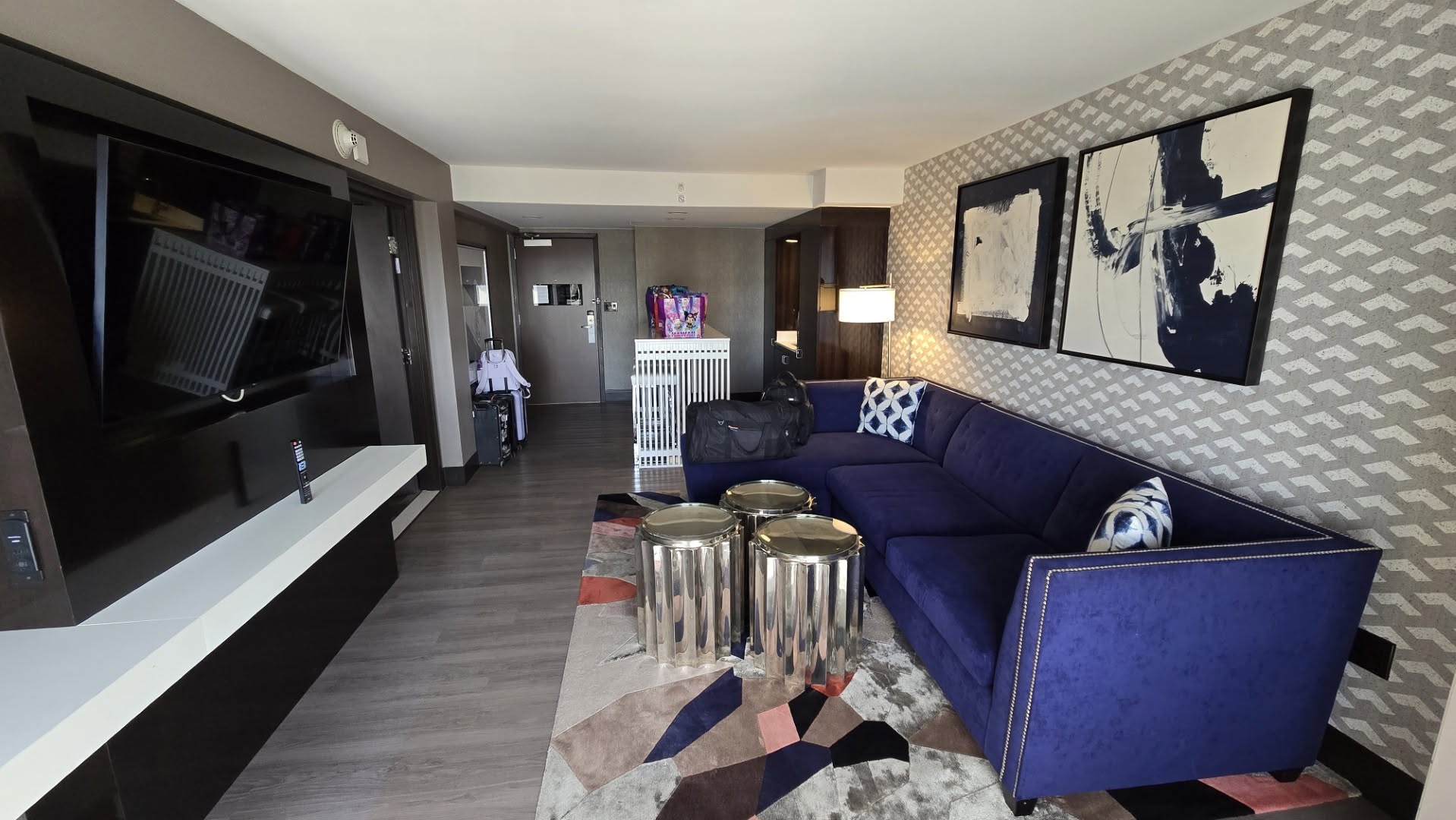 12th Floor King Suite Living Room with royal blue velvet sectional couch