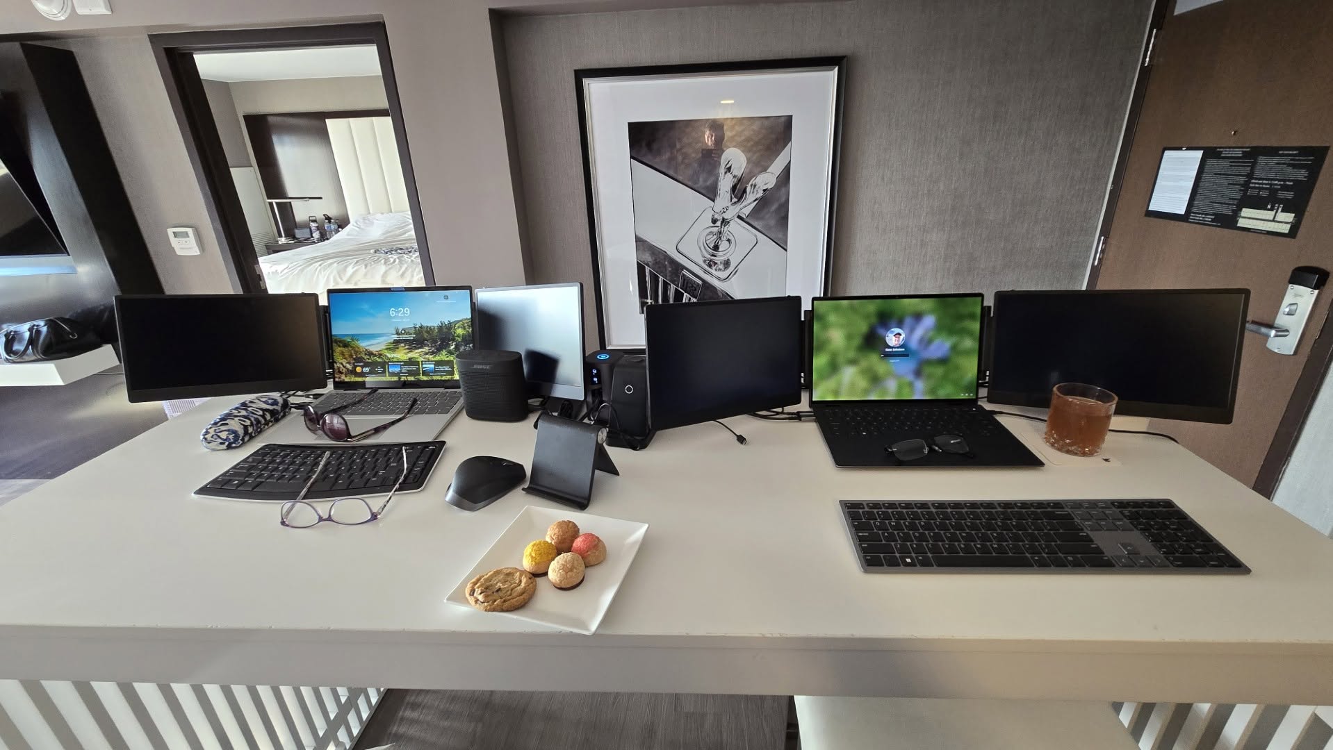 Gene and Maureen's dual laptop multi-monitor workstation setup on the high-top wet bar island