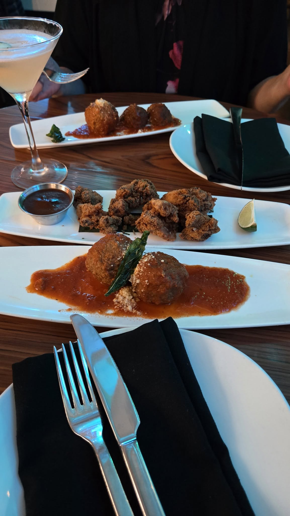 Living Room lobby bar happy hour spread with Wagyu meatballs and A5 tacos