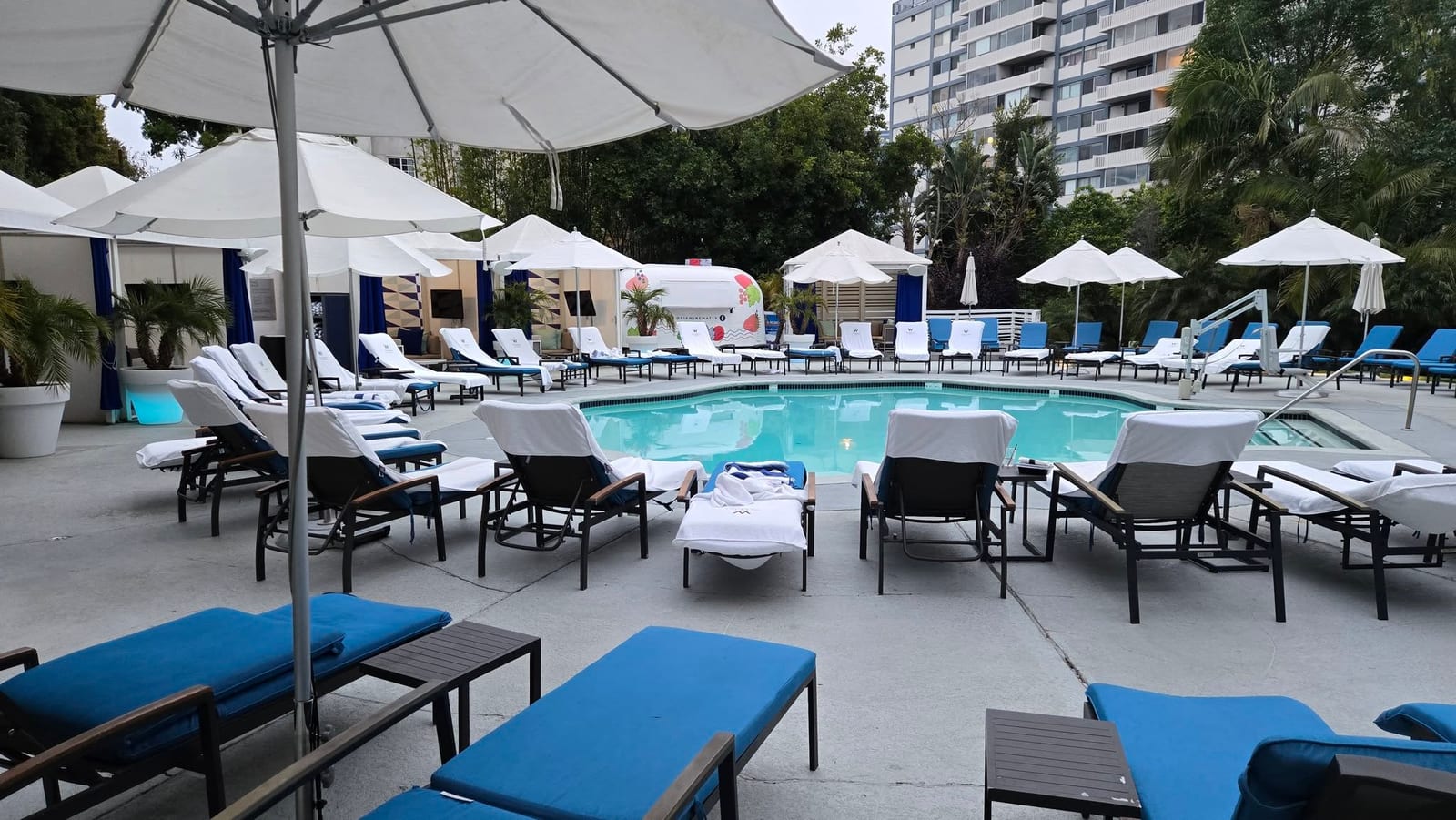 WET Deck heated outdoor swimming pool, royal blue loungers, and Airstream bar